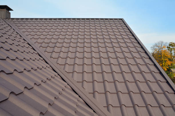 istock Metal roof construction with coaxial chimney pipe heating system against blue sky. 1140851642