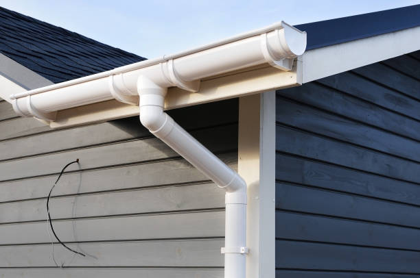 istock New rain gutter on a home against blue sky. 1140851650