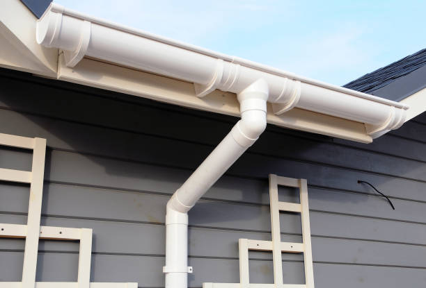 istock New rain gutter on a home against blue sky. 1140851668