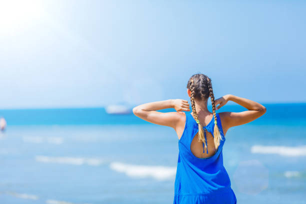 istock Girl having fun on the tropical beach 1140851868