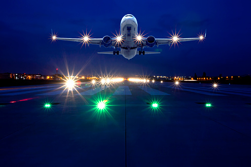 Passenger airplane taking off at night