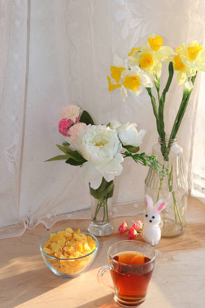 istock A mug of tea, a cup of corn and a cake on a sunny table 1140856048