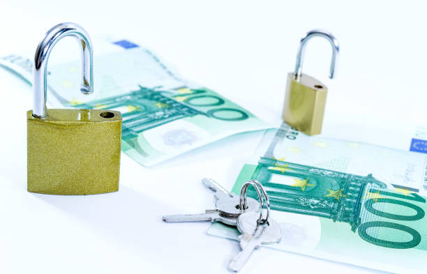 istock Money Euro value banknotes with padlock, European Union payment system 1140856242