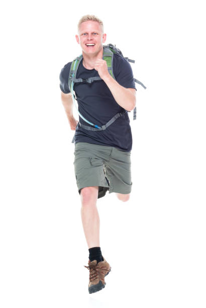 istock Attractive young male hiker running and jumping 1140856566