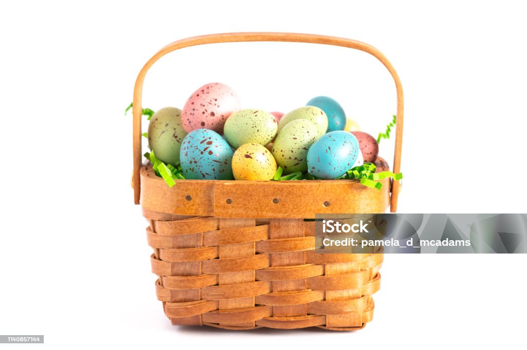 A Wooden Easter Basket Filled with Decorated Eggs Isolated on a White Background Easter Basket Stock Photo