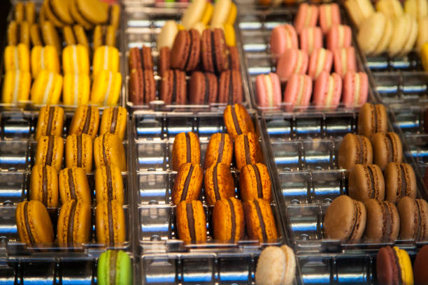 istock Colorful macaron assortment behind a pastry shop window 1140858015