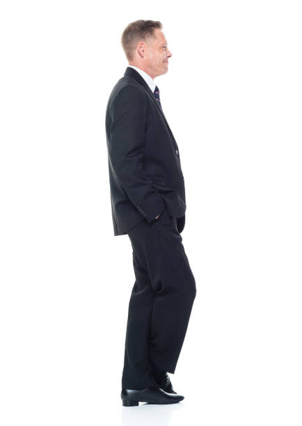 istock Businessman is standing with hands in pockets 1140859413