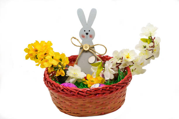 istock Easter bunny, eggs and flowers in a grass 1140863109