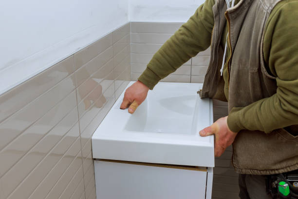 istock A bathroom remodel counter tap bathroom vanity cabinets to completion. 1140864234