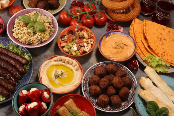 istock Middle eastern or arabic dishes and assorted meze, concrete rustic background. Falafel. Turkish Dessert Baklava with pistachio. Halal food. Lebanese cuisine 1140868723