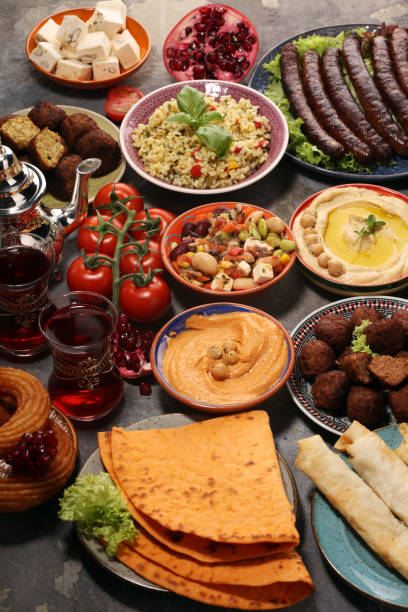 istock Middle eastern or arabic dishes and assorted meze, concrete rustic background. Falafel. Turkish Dessert Baklava with pistachio. Halal food. Lebanese cuisine 1140868872