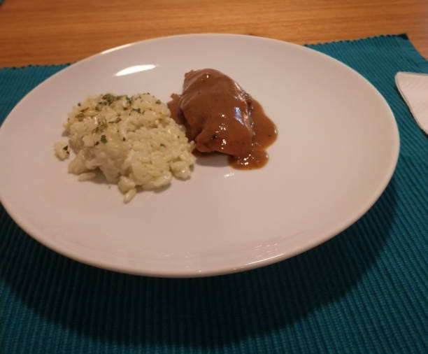 Beef with madeira sauce and piamontese rice Served on a white plate madeira sauce stock pictures, royalty-free photos & images
