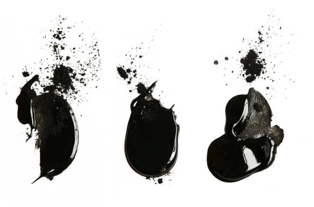 istock Black clay or charcoal face mask strokes isolated on white 1140877138