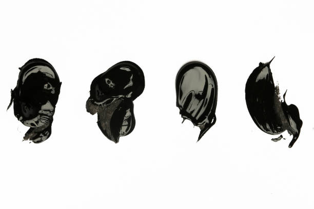 Black clay or charcoal face mask strokes isolated on white