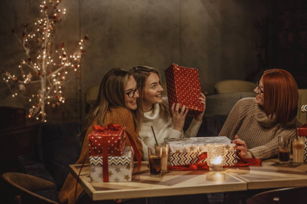 istock Three women enjoying coffee and gifts 1140878915