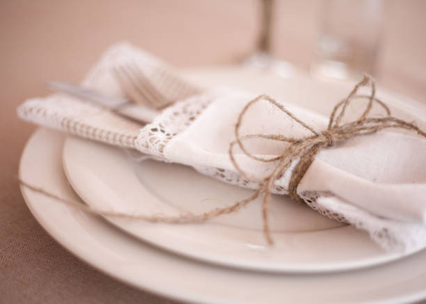 istock Elegant restaurant table setting for fine dining with plates cutlery and stemware 1140890914