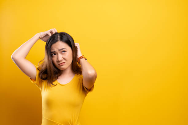 istock Woman scratching her head 1140891088
