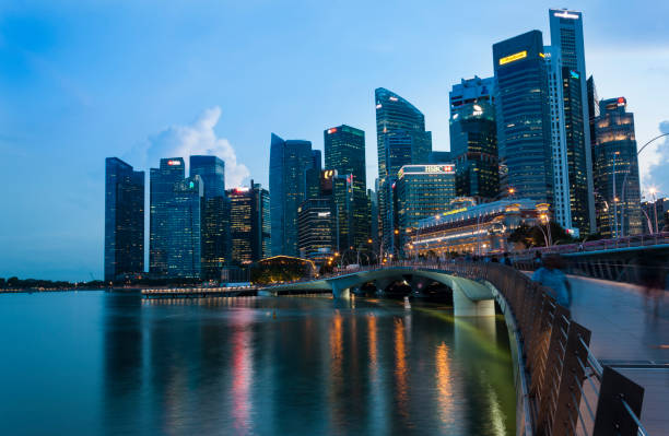 Singapore financial district skyline at Marina bay on twilight time Singapore financial district skyline at Marina bay on twilight time association of southeast asian nations photos stock pictures, royalty-free photos & images