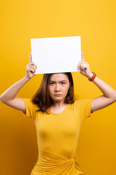 istock Angry woman covering face with paper 1140894753