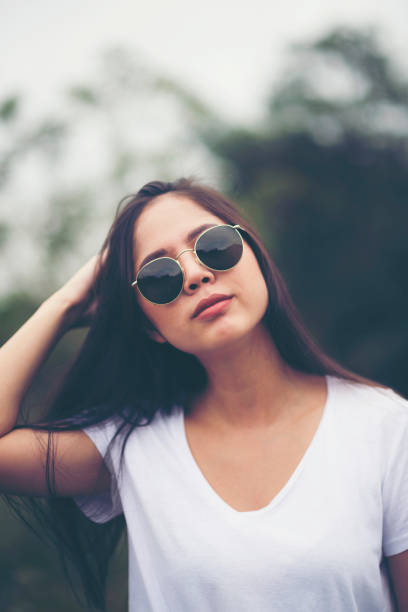 istock portrait girl on outdoors with sunglasses 1140904296