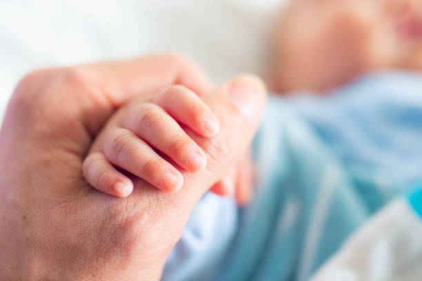 istock Holding baby hand,father love you forever 1140905475