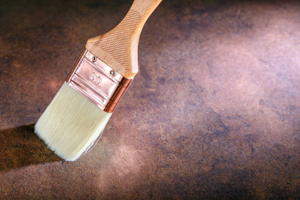 istock Brush on brown surface with copy space. House renovation concept. 1140907114