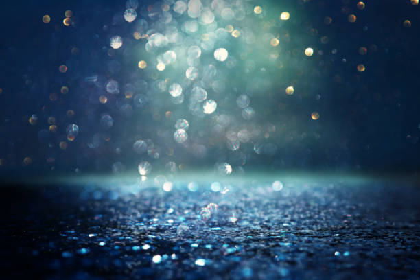 istock glitter vintage lights background. black and blue. de-focused 1140910376