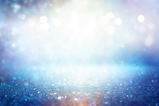 istock glitter vintage lights background. silver and blue. de-focused 1140910379