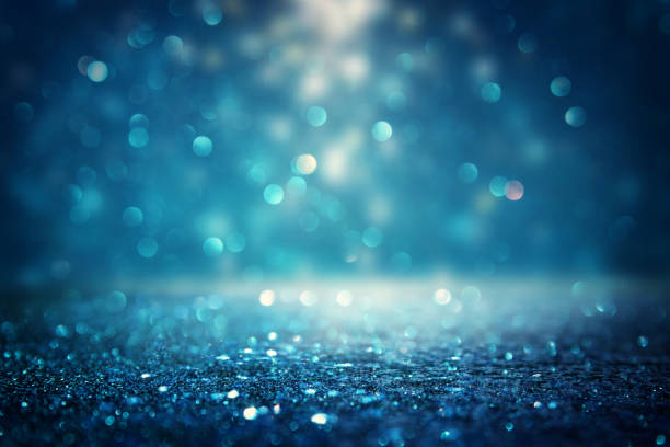 istock glitter vintage lights background. black and blue. de-focused 1140910382