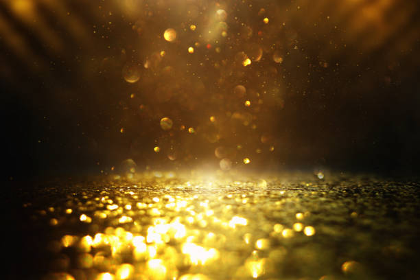 istock glitter vintage lights background. black and gold. de-focused 1140910385