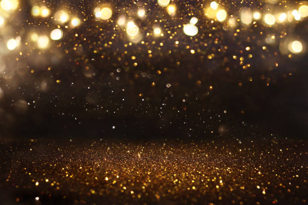 istock glitter vintage lights background. black and gold. de-focused 1140914268