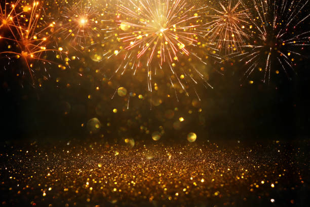istock glitter vintage lights background. black and gold. de-focused 1140914269