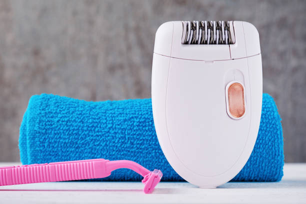 istock Epilator, shaving razor and bathroom towel 1140916975