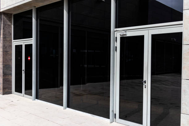 istock Dark translucent sun covered glass wall facade 1140919276