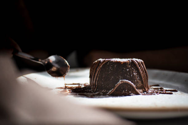 istock Italian chocolate dessert courant on a white plate and silver spoon 1140926268