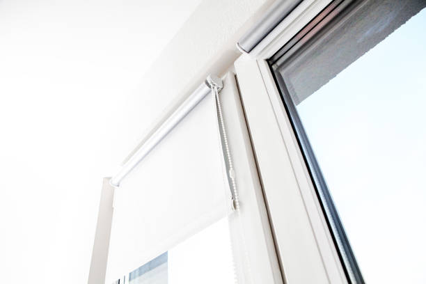 istock roller blind on the top of the window 1140926279