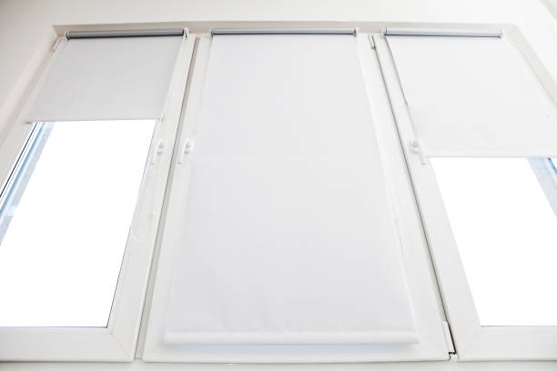 roller blind on the top of the window roller blind on the top of the window retractable photos stock pictures, royalty-free photos & images