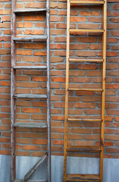 Spare staircase on wall of building. Steel staircase. Fire escape from house.