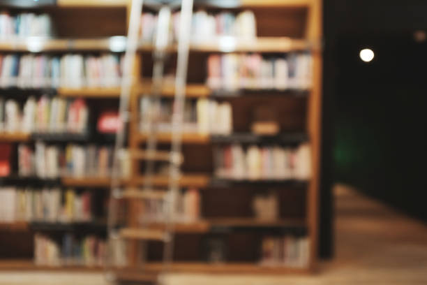istock Blurred Academic Library Student Learning Concept. blur group of people working at co-working space, casual style, , business, education concept.Blur library background 1140929743