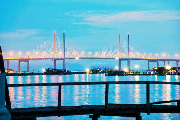 istock Long exposure view of a bridge by shore in black and white 1140931551