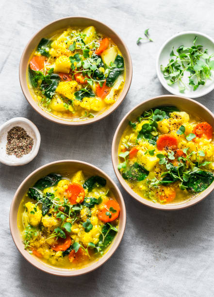 istock Lentils, turmeric, vegetables potatoes, carrots, cauliflower, turnips vegetarian soup on a light background, top view. Healthy food concept 1140931635