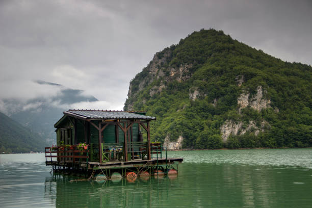 TARA National park, Western Serbia - A raft log cabin anchored on the Lake Perucac (Perućac) stock photo