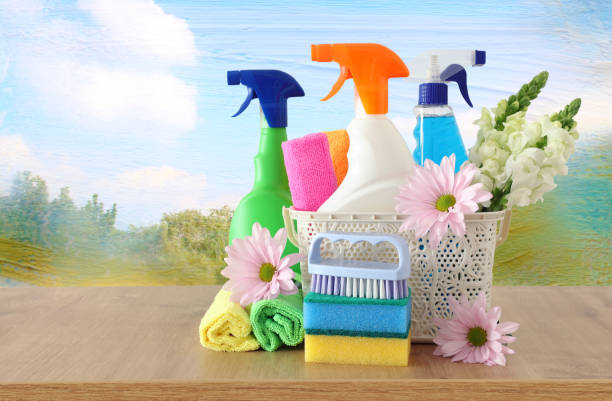 istock Spring cleaning concept with supplies on wooden table 1140934688