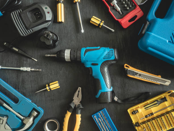 istock top view of Construction tools concept with Drill sets, hammer, screwdriver and Toolbox on black wooden background. 1140936797