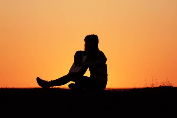 istock Silhouette of a guitar player at sunset 1140937124