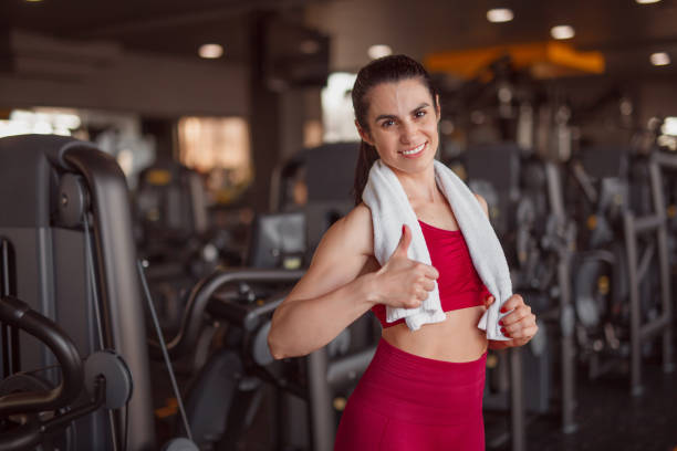 istock Smiling sportswoman gesturing thumb up 1140940667