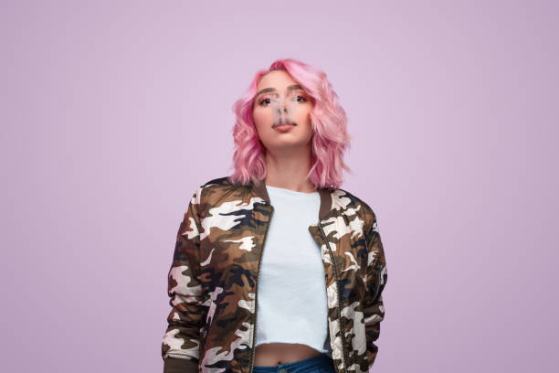 istock Sensual hipster exhaling smoke 1140940691