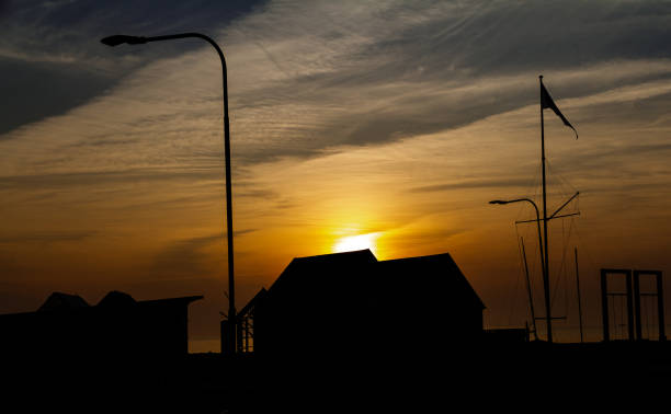 istock Sunrise over wooden sheds 1140940828