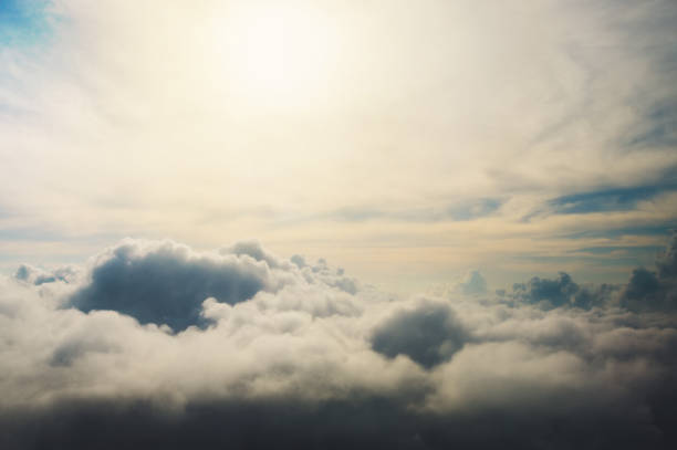 istock Under the clouds shot from a bird's flight, the sun shines on the clouds 1140951145
