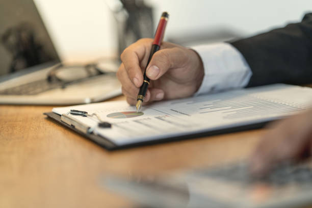 istock The accountant checking documents about graph and chart relating to financial reporting and tax accounting of the company 1140951616